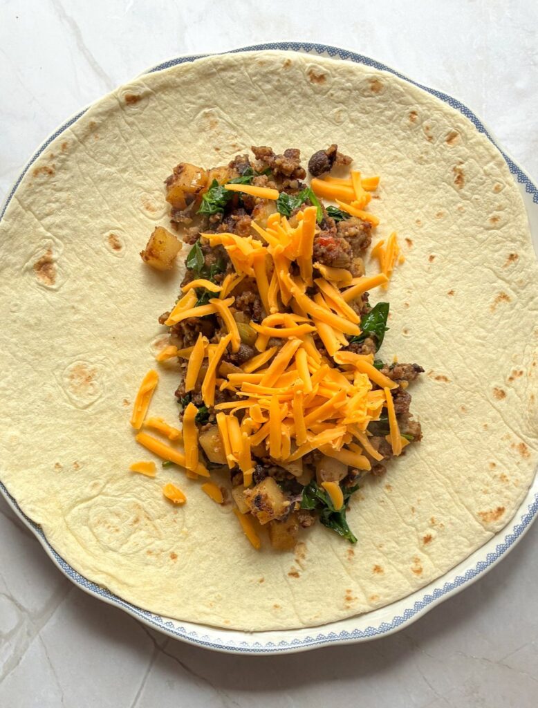Filling inside a burrito before its been rolled up
