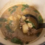 Sausage, potato and spinach soup in dutch oven finished cooking