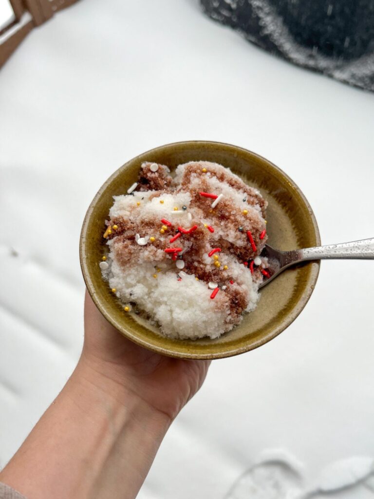 Snow Ice Cream in a bowl being held by a hand