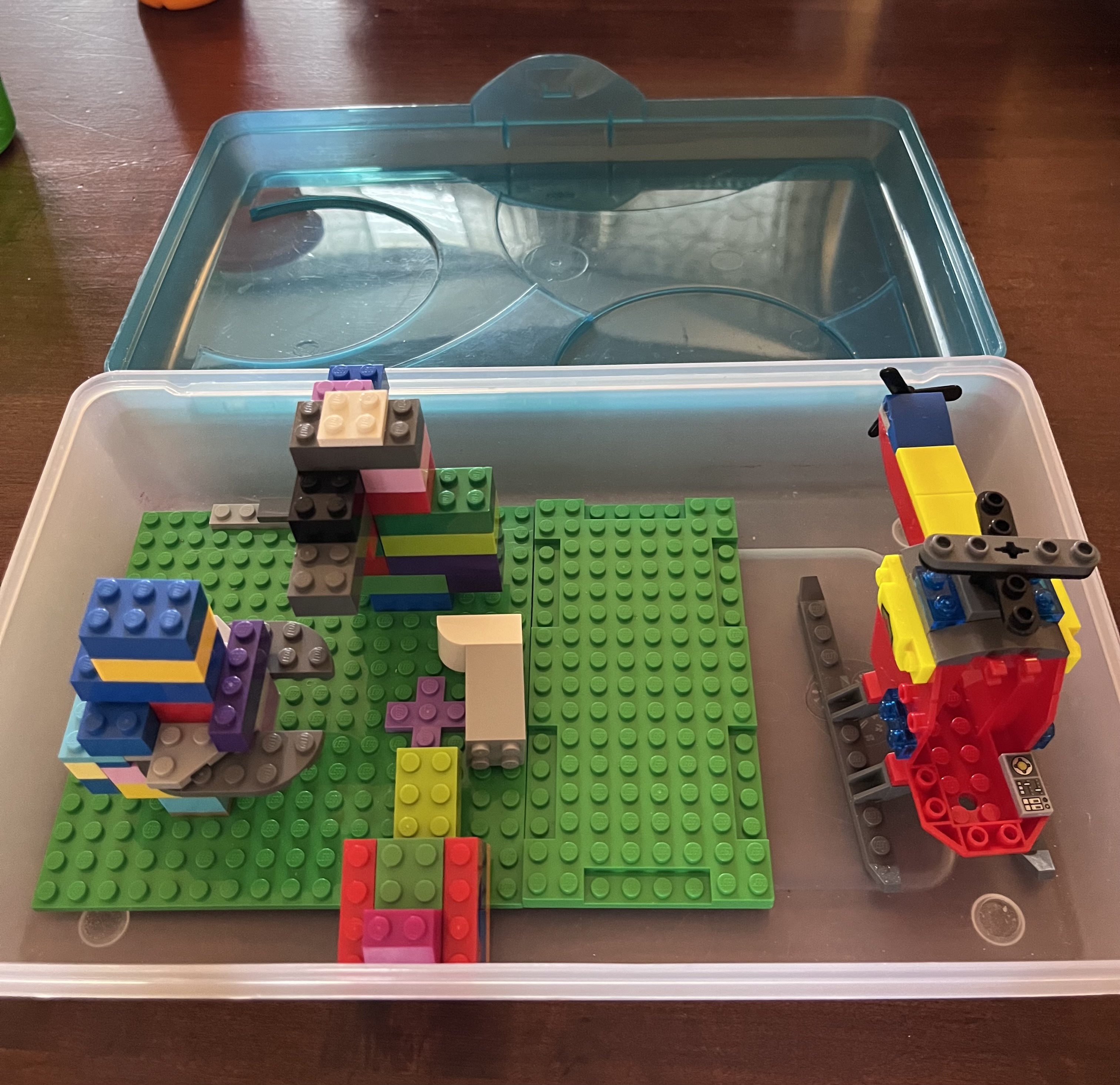 Homemade lego travel kit with legos inside a large pencil carrying case