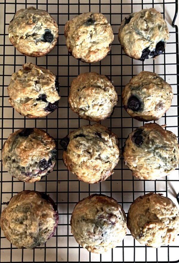 Sourdough Discard Banana Blueberry Muffins served on a cooling rack