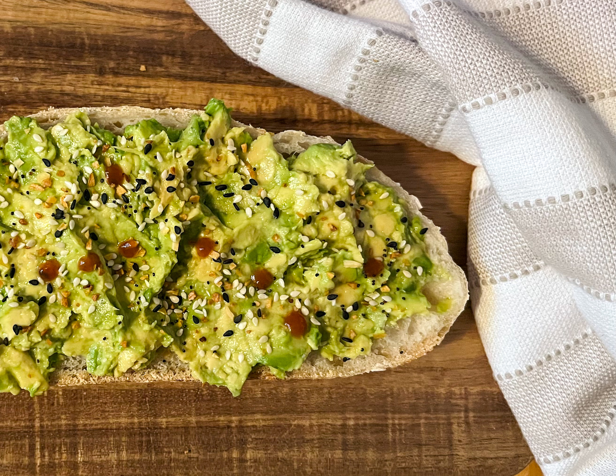 Avocado Toast with sriracha Served on a plate