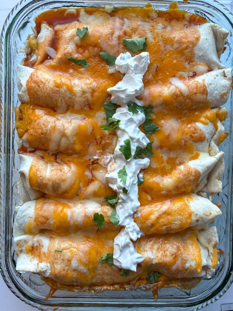 pulled pork enchiladas finished baking in a dish