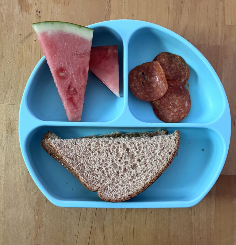 Preschool lunch of sunflower butter and jelly, turkey pepperoni and watermelon