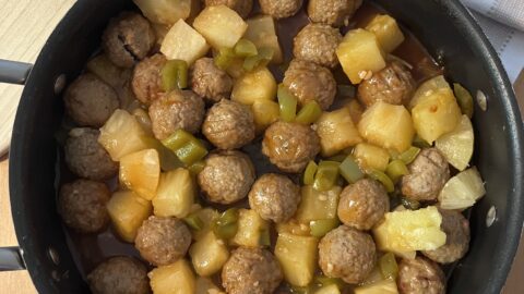 Sweet and sour meatballs cooked and served in a skillet