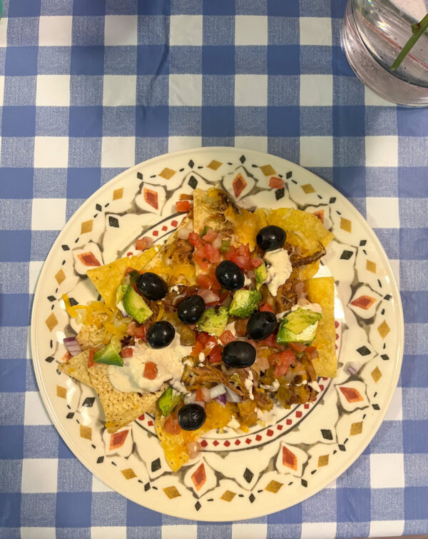 BBQ pulled pork nachos served on a plate