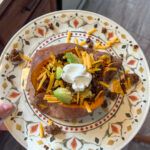 Loaded sweet potato served on a plate