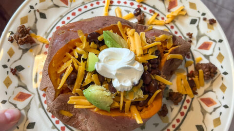 Loaded sweet potato served on a plate