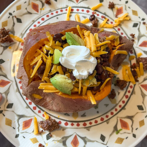 Loaded sweet potato served on a plate