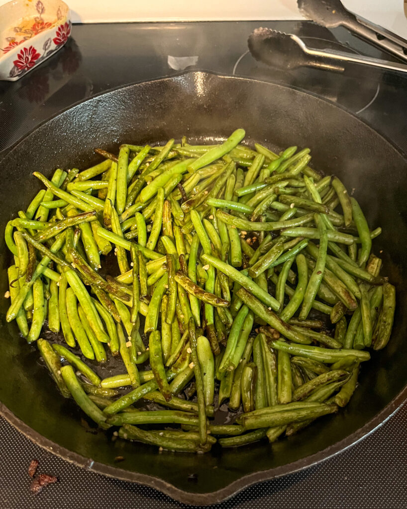 sauteed green beans in cast iron skillet