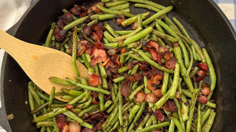 sauteed green beans, bacon, and onion in cast iron skillet