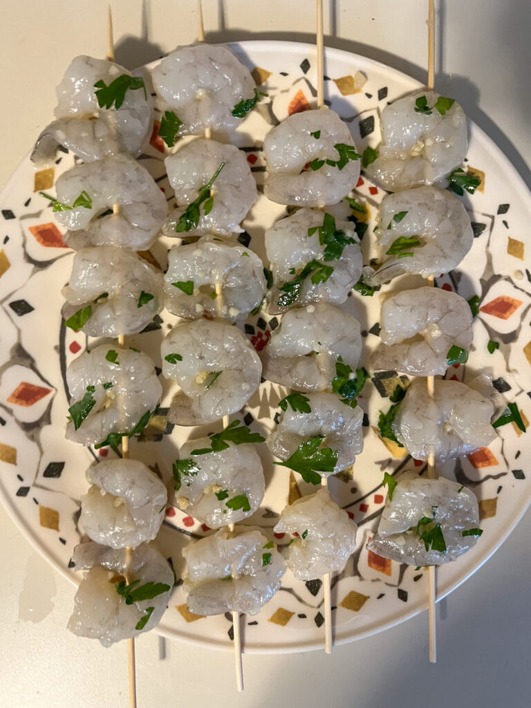 Raw shrimp on skewers before cooking