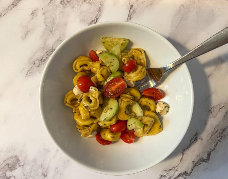 Tortellini Pasta Salad served in a bowl with a fork