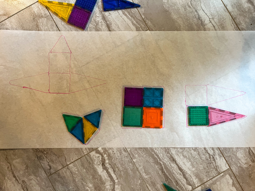 magnet tiles puzzle shapes on butcher paper