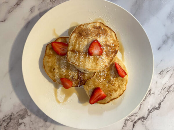 breakfast pancakes with strawberries on top