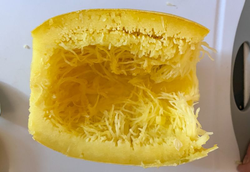 Spaghetti squash sliced in half with seeds removed