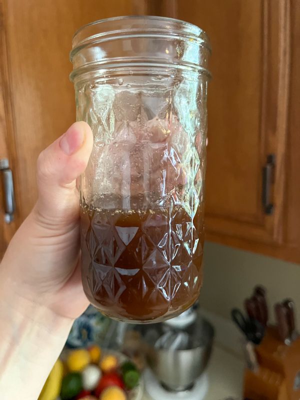 mason jar filled with salad dressing