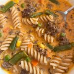 creamy ground beef and tomato soup in a small bowl for serving