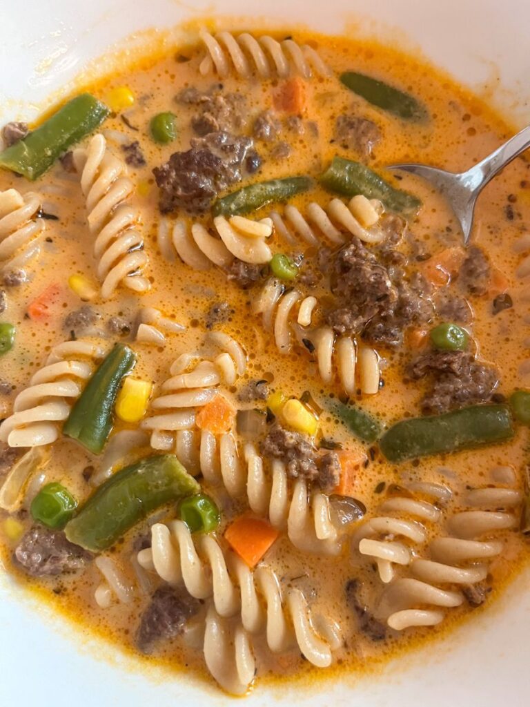 creamy ground beef and tomato soup in a small bowl for serving