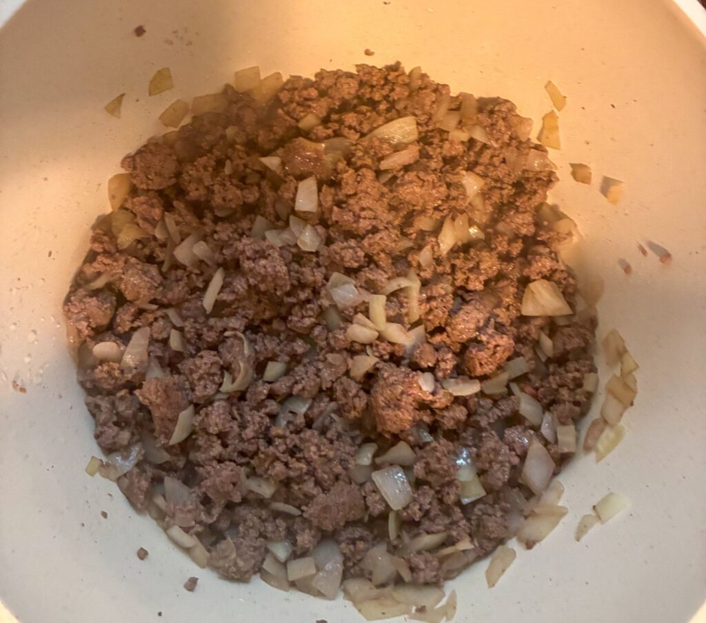 ground beef and onions sauteed in a large pot