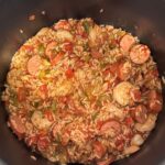 jambalaya with sausage in shrimp in a large pot