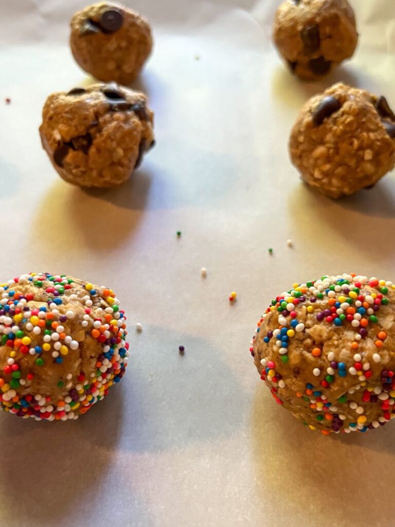 6 no bake protein balls on parchment paper