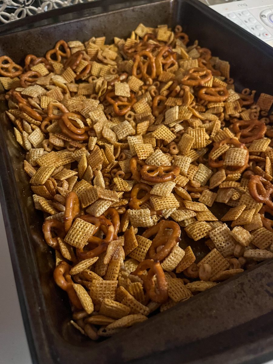 homemade chex mix in a large baking dish