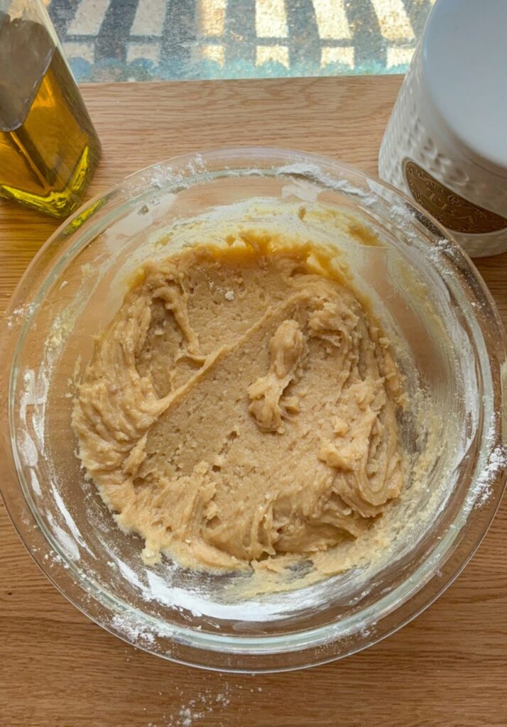 Dough without chocolate chips added yet in a large mixing bowl