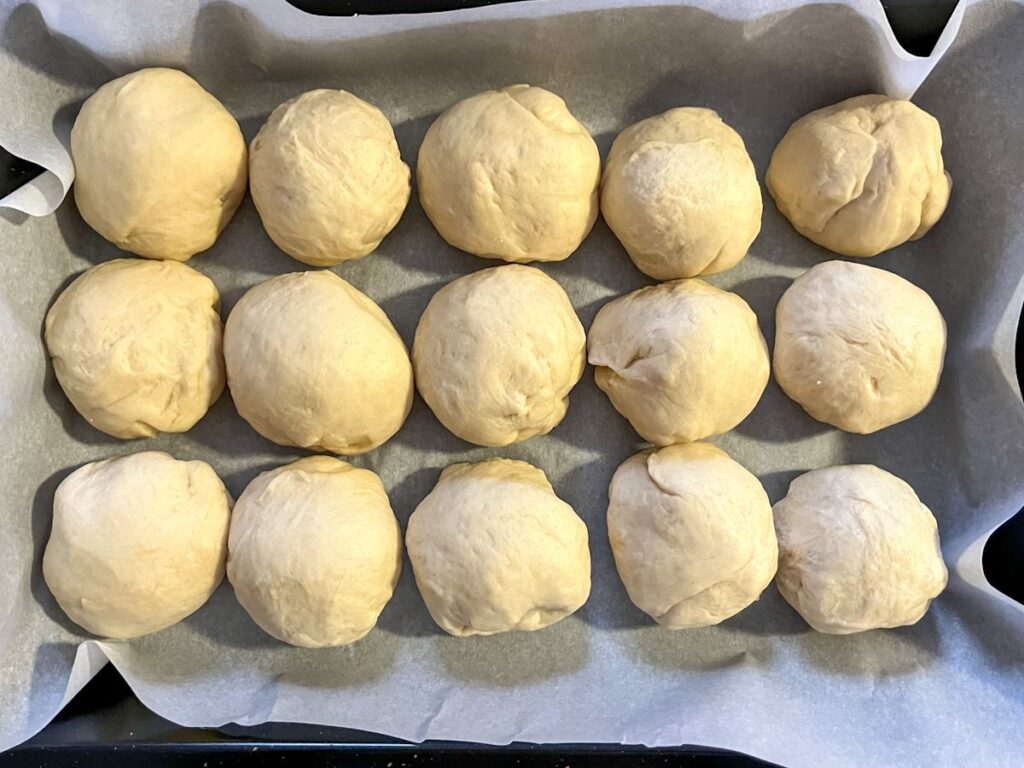dinner rolls formed into balls before they have puffed up