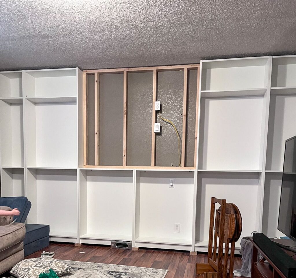 Ikea billy bookcases with the framed 2x4 in the middle. This allows the shiplap to be added on top.