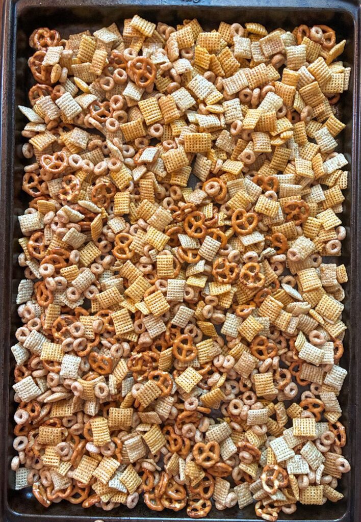 Baking sheet with the homemade chex mix spread out prior to baking