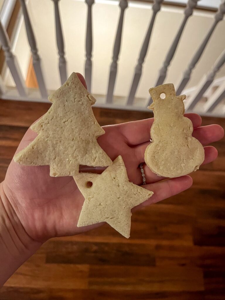 3 small ornaments being held in a hand