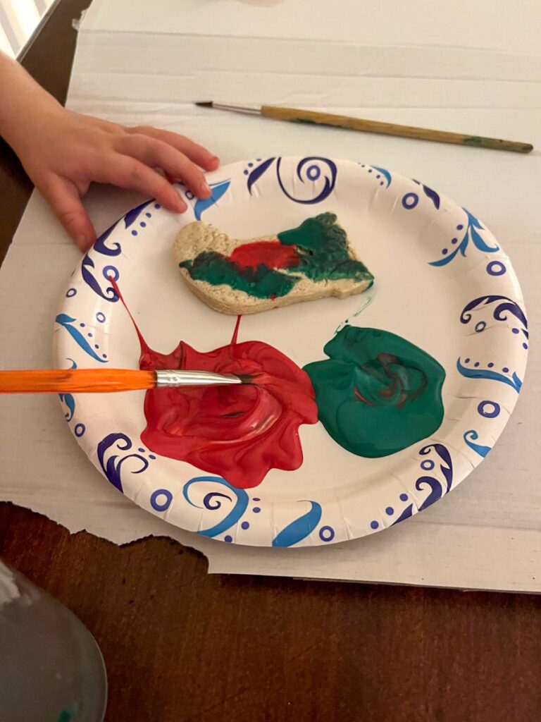 an ornament on a plate being panted