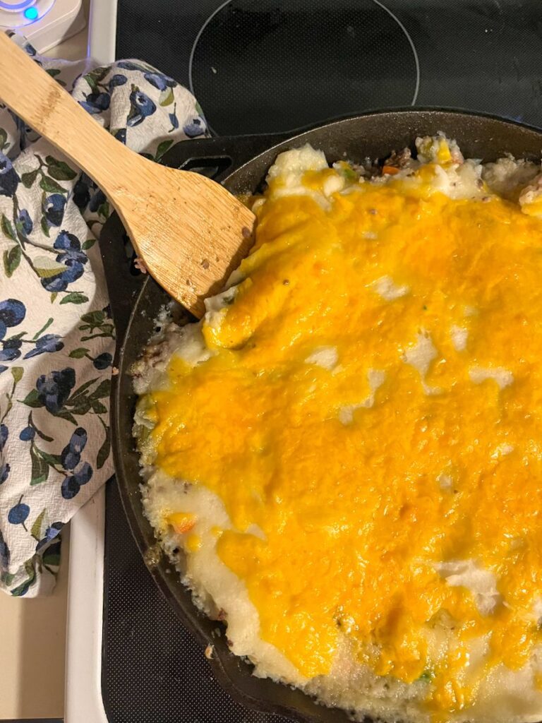 shepherds pie with instant potatoes served in a large cast iron skillet