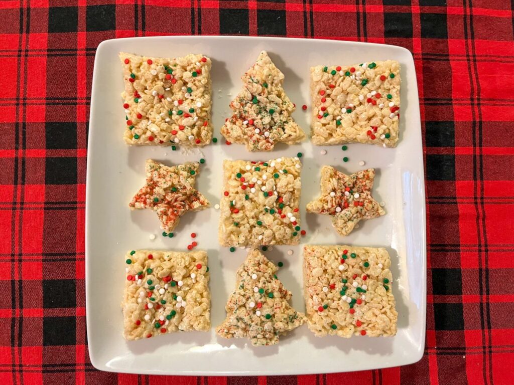 Christmas rice krispie treats cut into squares, stars, and christmas trees