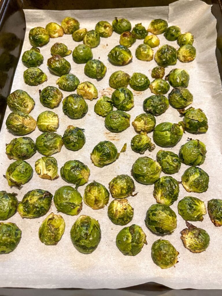 brussel sprouts after they have been cooked on a baking sheet