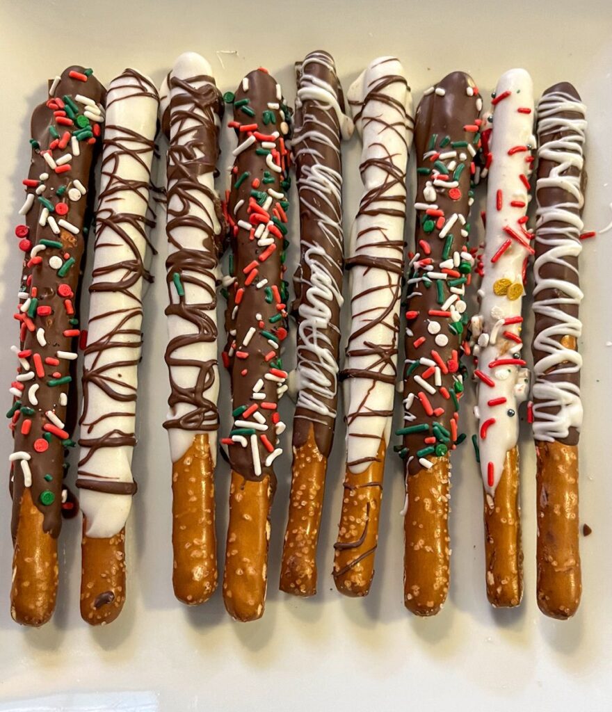 Christmas pretzels rods laid out on a plate to display