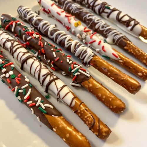 chocolate covered pretzel rods placed on a plate