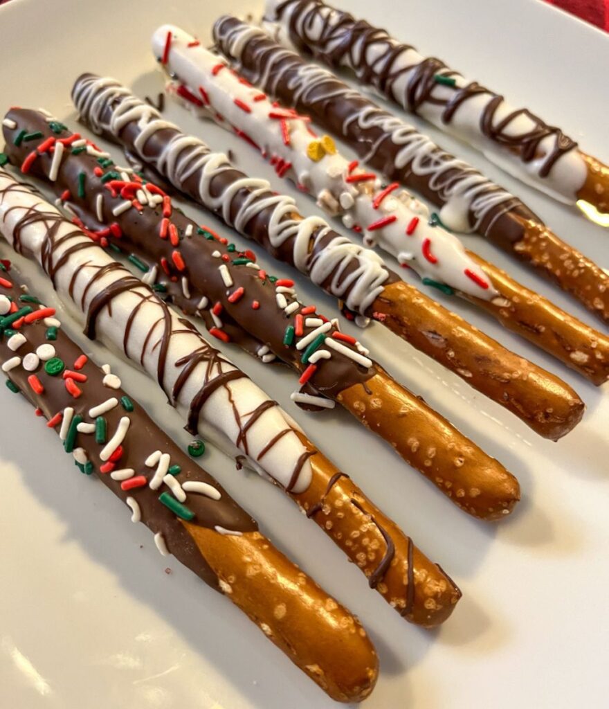 chocolate covered pretzel rods placed on a plate