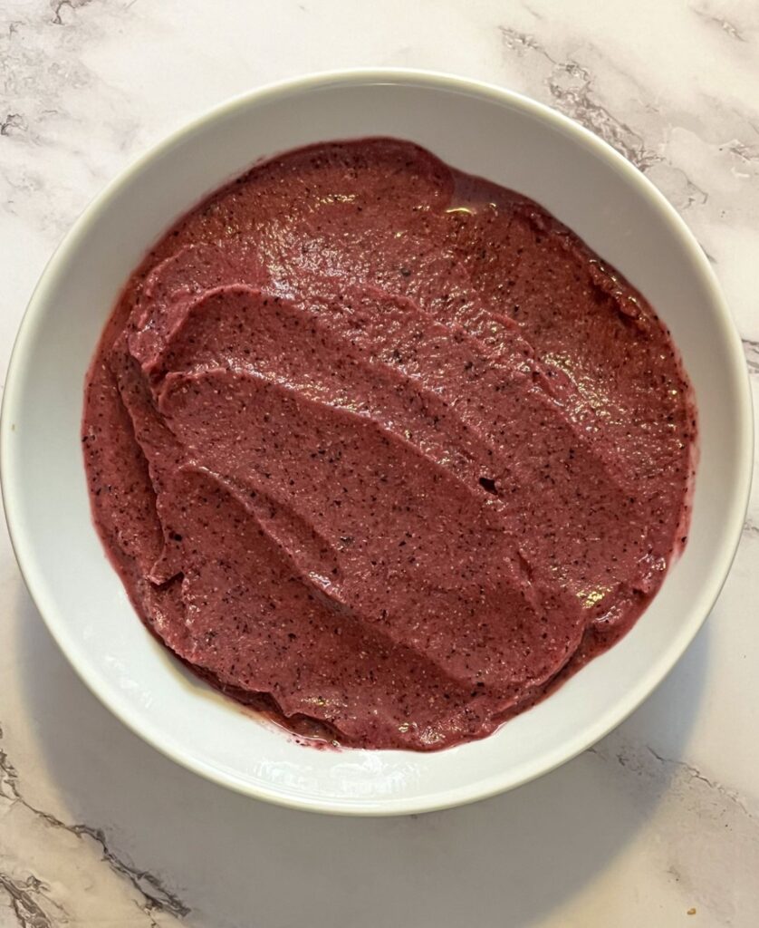 smoothie spread out in a bowl without toppings on it
