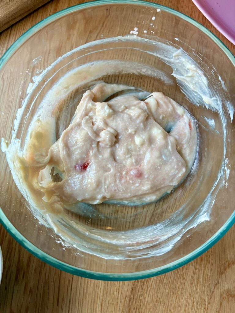 Cheesecake mixture in a small bowl ready to go inside the strawberries