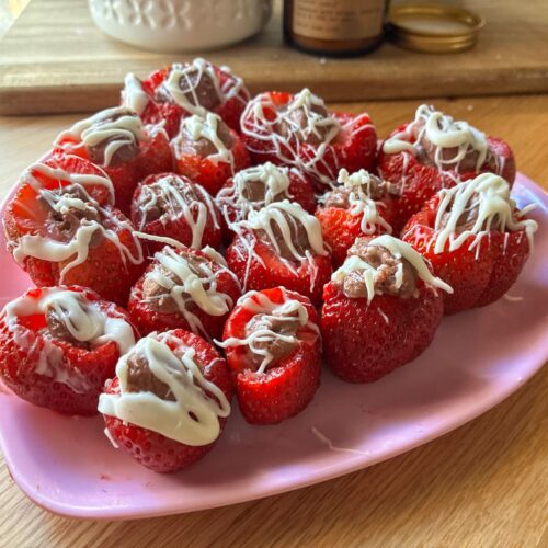Chocolate filled strawberries on a plate