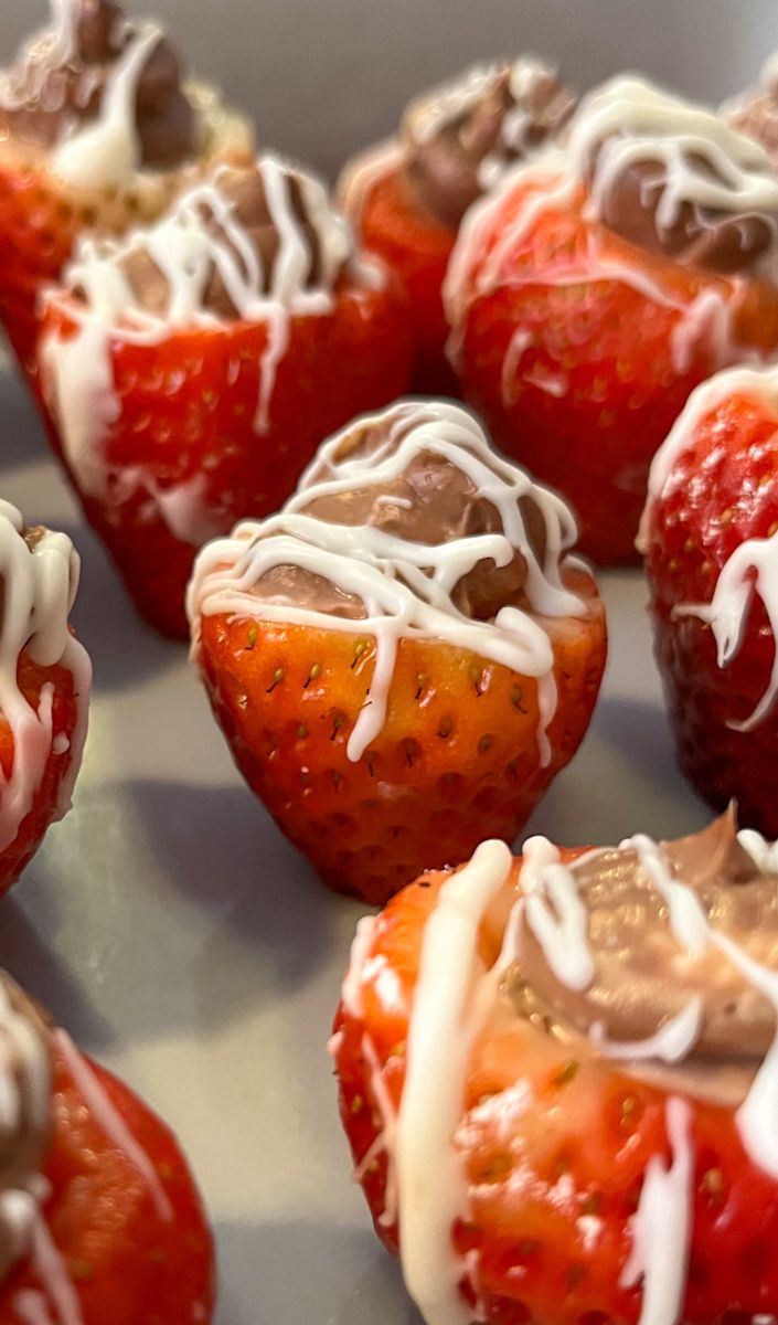 Chocolate filled strawberries on a platter