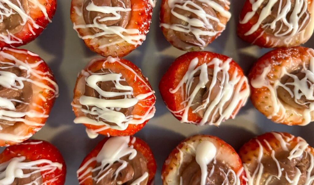strawberries with white chocolate drizzled on top