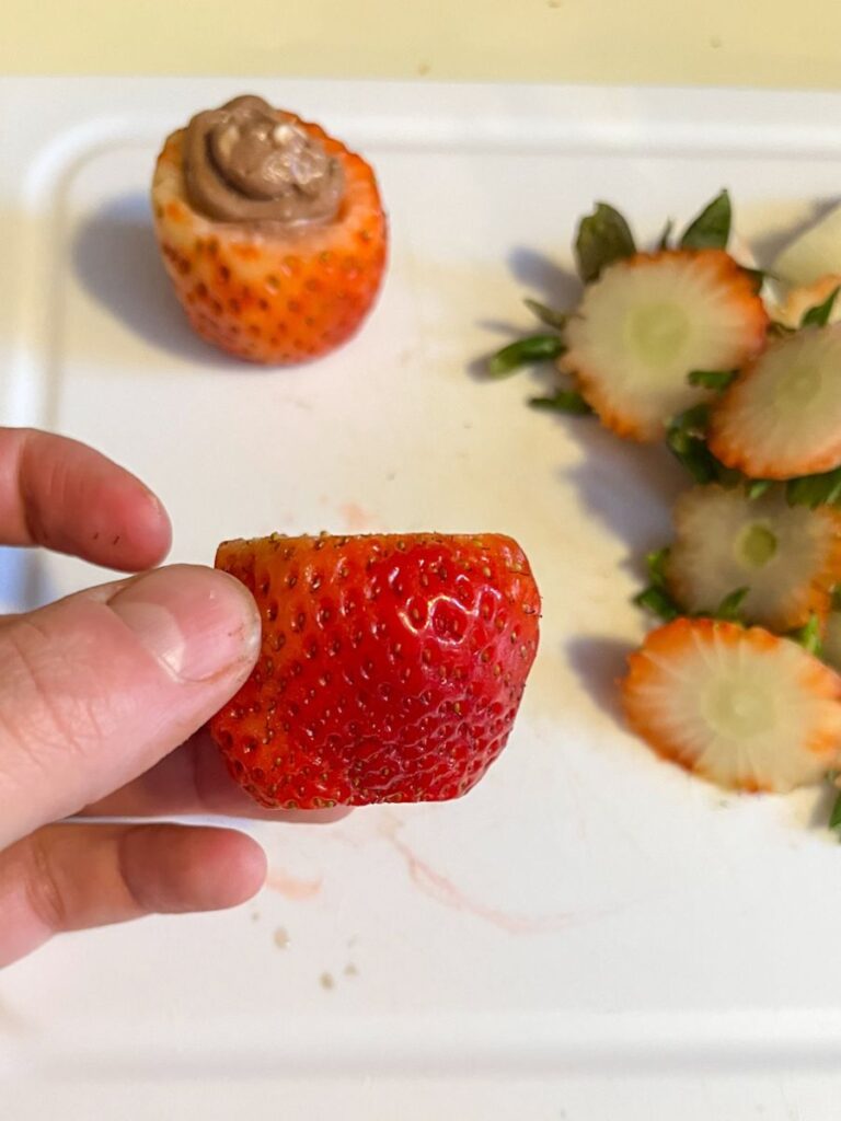 A strawberries with the top and bottom slightly cut off