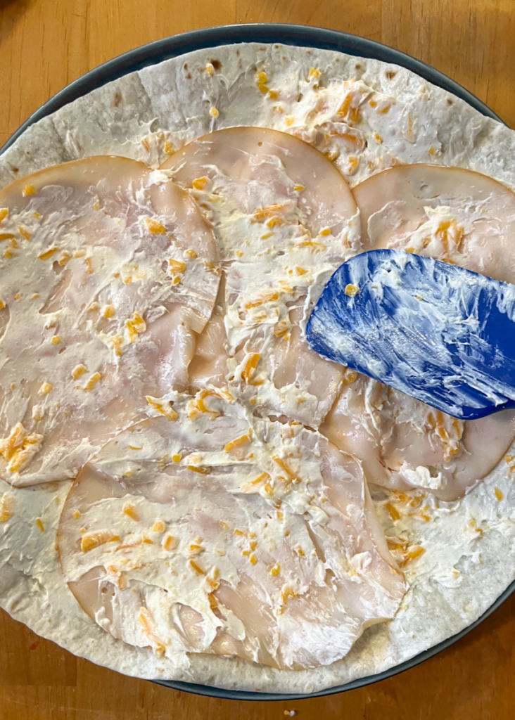 Open faced tortilla before it is rolled up