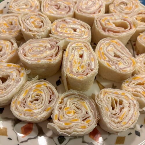 Tortilla Roll Ups spread out on a plate