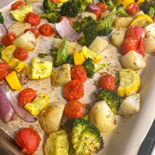 Italian roasted vegetables on a baking sheet fresh out of the oven