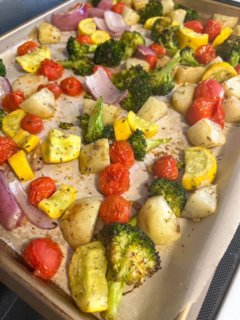 Italian roasted vegetables on a baking sheet fresh out of the oven