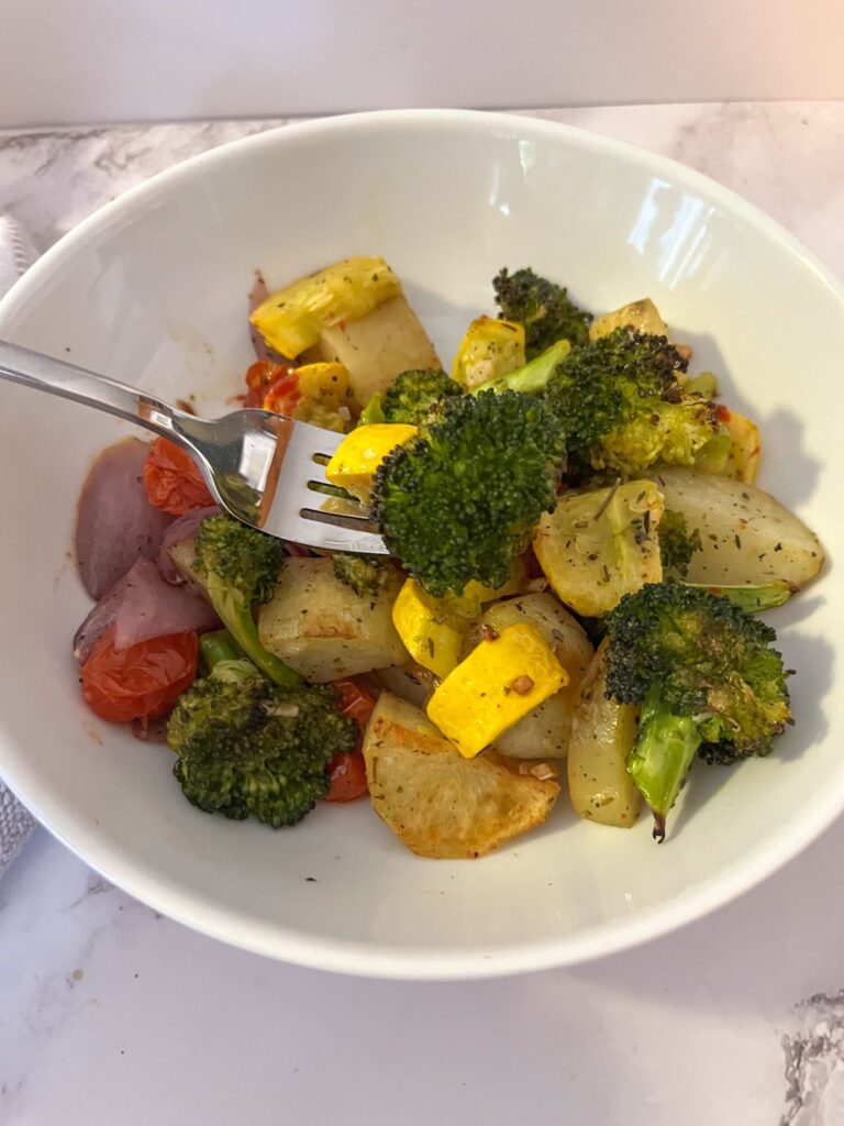Italian roasted vegetables served in a bowl with a fork